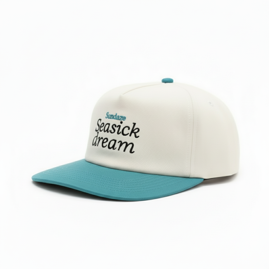 Cap with 'Seasick dream' text on a white background