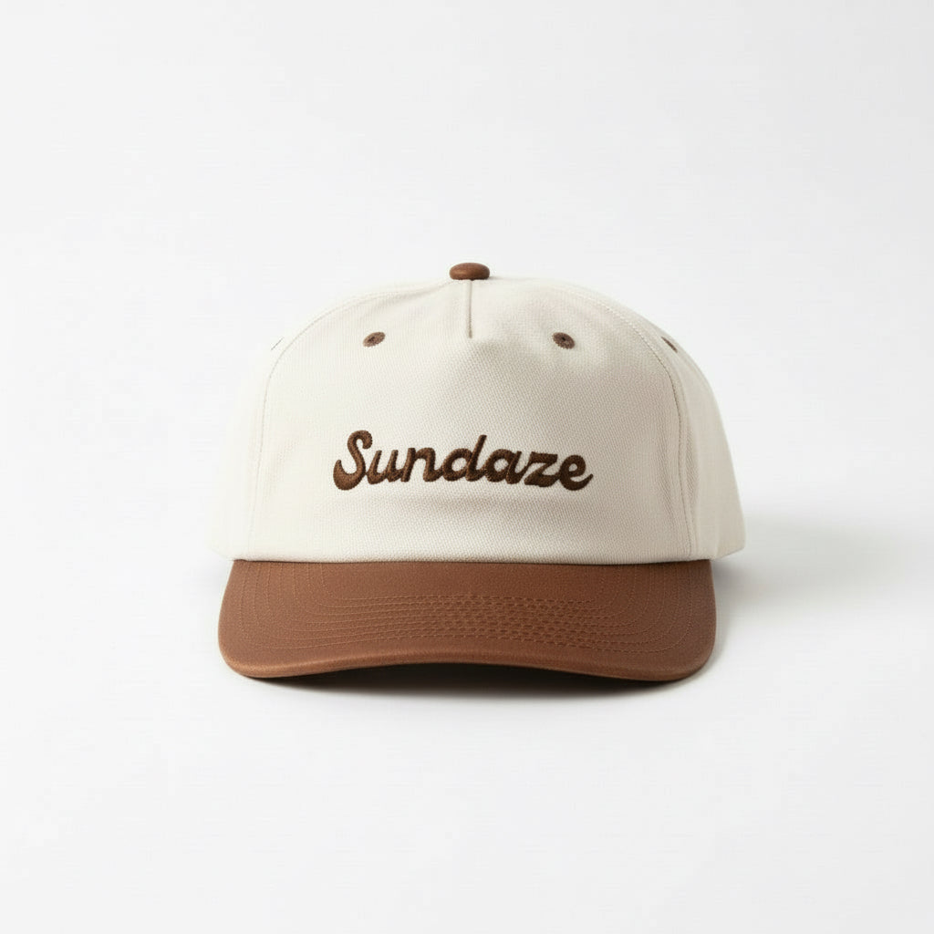 Beige and brown cap with 'Sundaze' embroidery on a white background